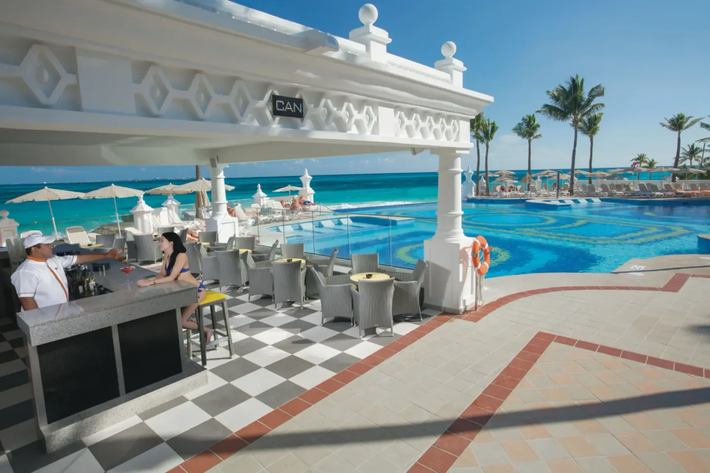 Can pool bar beside the pool and beach at Hotel Riu Palace Las Americas.