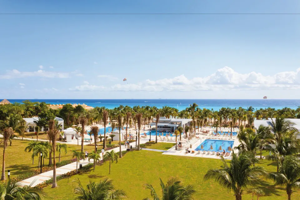 Resort grounds with multiple pools and ocean on the horizon at Hotel Riu Palace Mexico