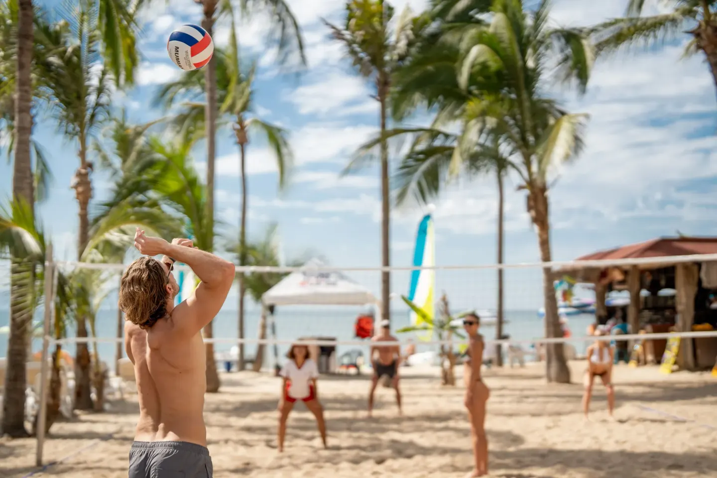 Beach volleyball game on the sand at Hotel Riu Palace Pacifico.