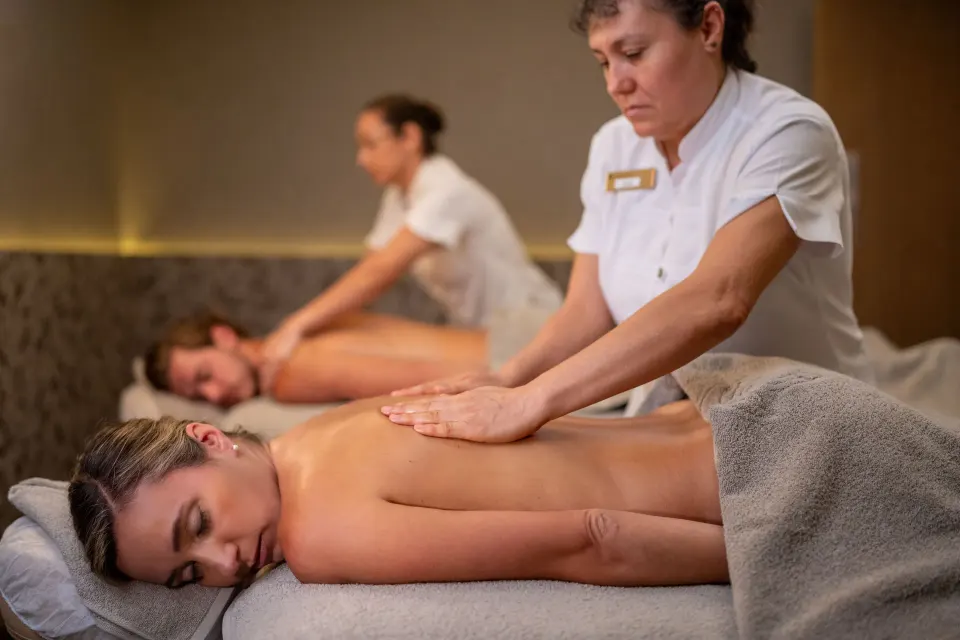 Massage therapists giving side-by-side treatments at Hotel Riu Palace Pacifico.
