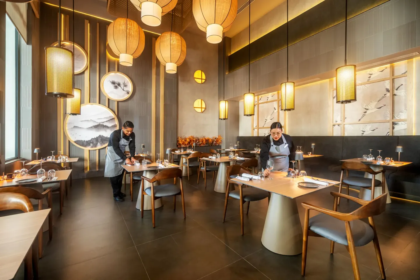 An Asian-style dining room is being set for service at Hotel Riu Palace Pacifico.