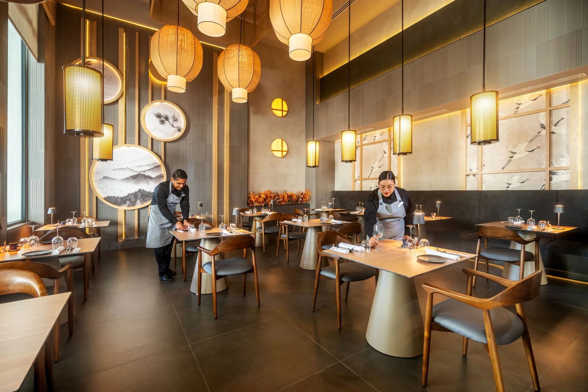 An Asian-style dining room is being set for service at Hotel Riu Palace Pacifico.