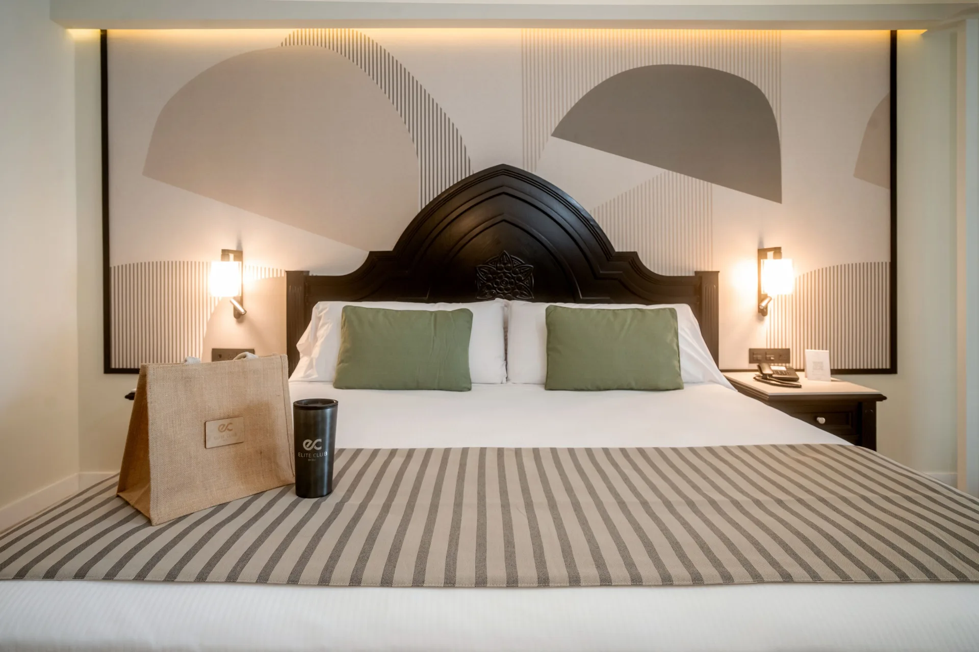 Elite Club Junior Suite Oceanfront king bed close-up at Hotel Riu Palace Pacifico.
