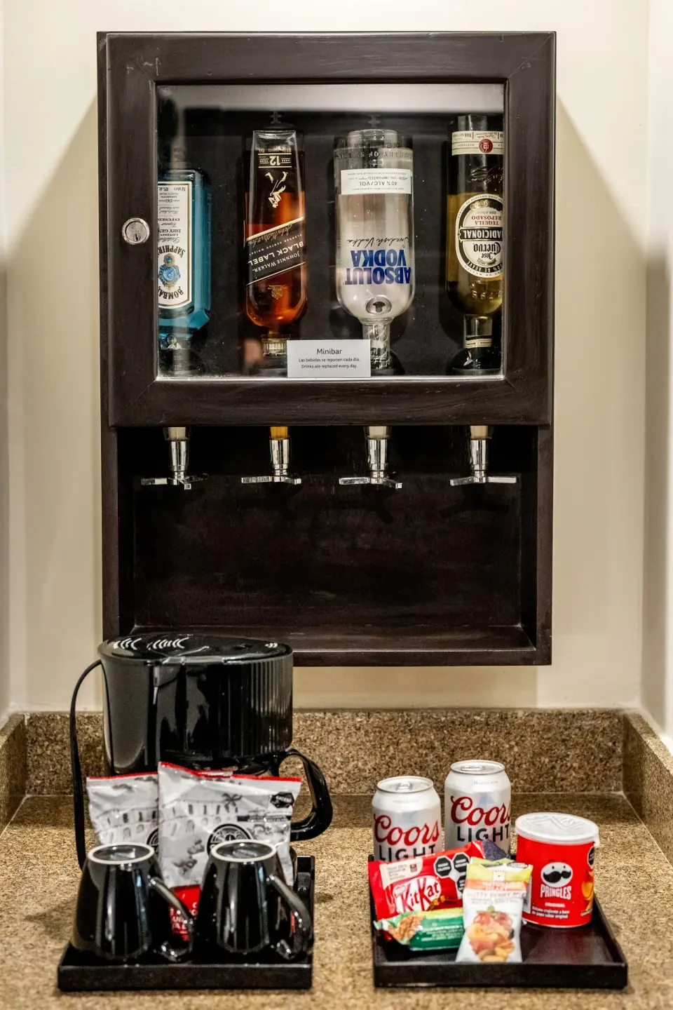 In-room minibar and snacks in a Junior Suite at Hotel Riu Palace Pacifico.