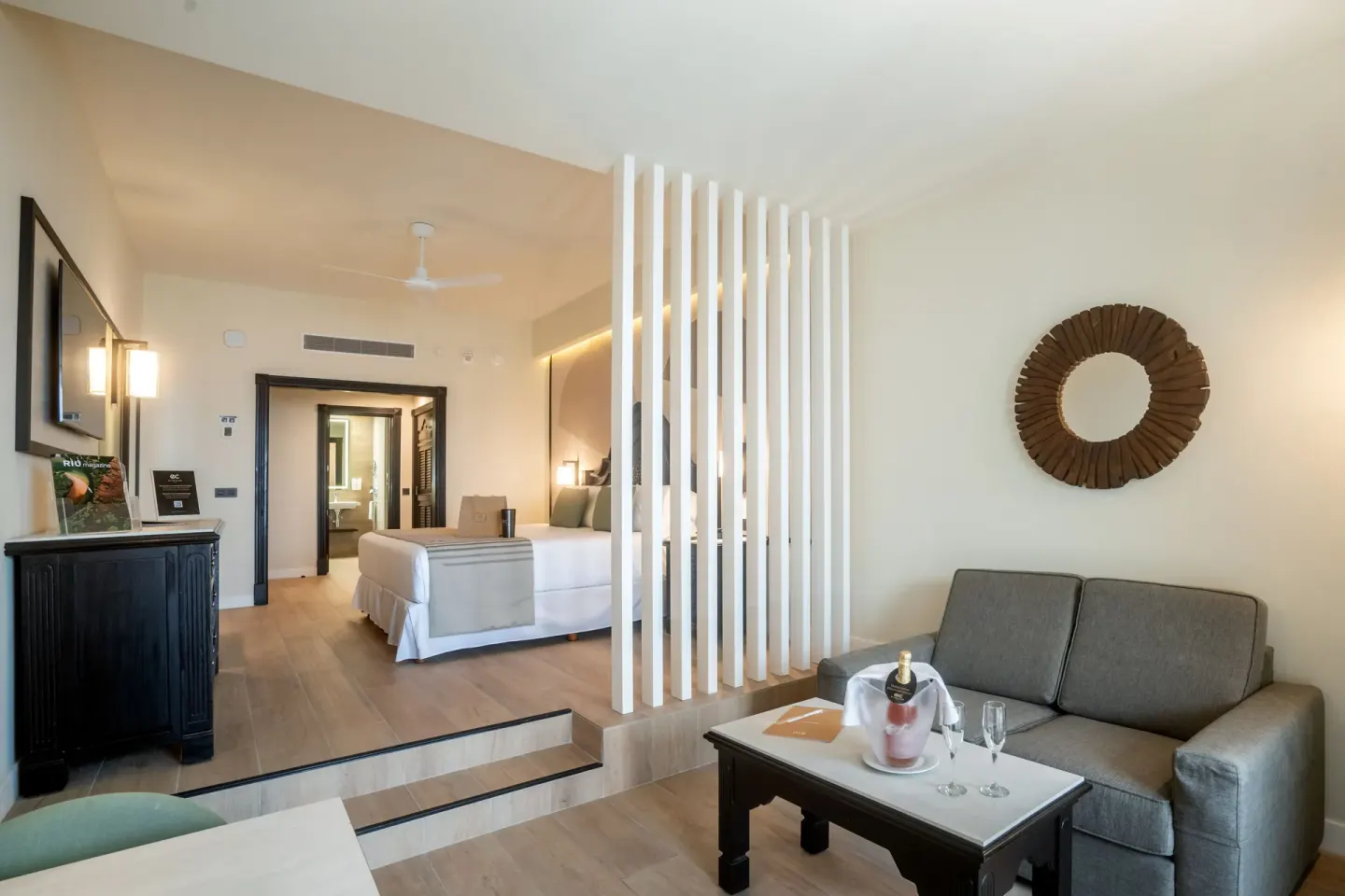 Junior Suite Ocean View sitting area and bed at Hotel Riu Palace Pacifico.