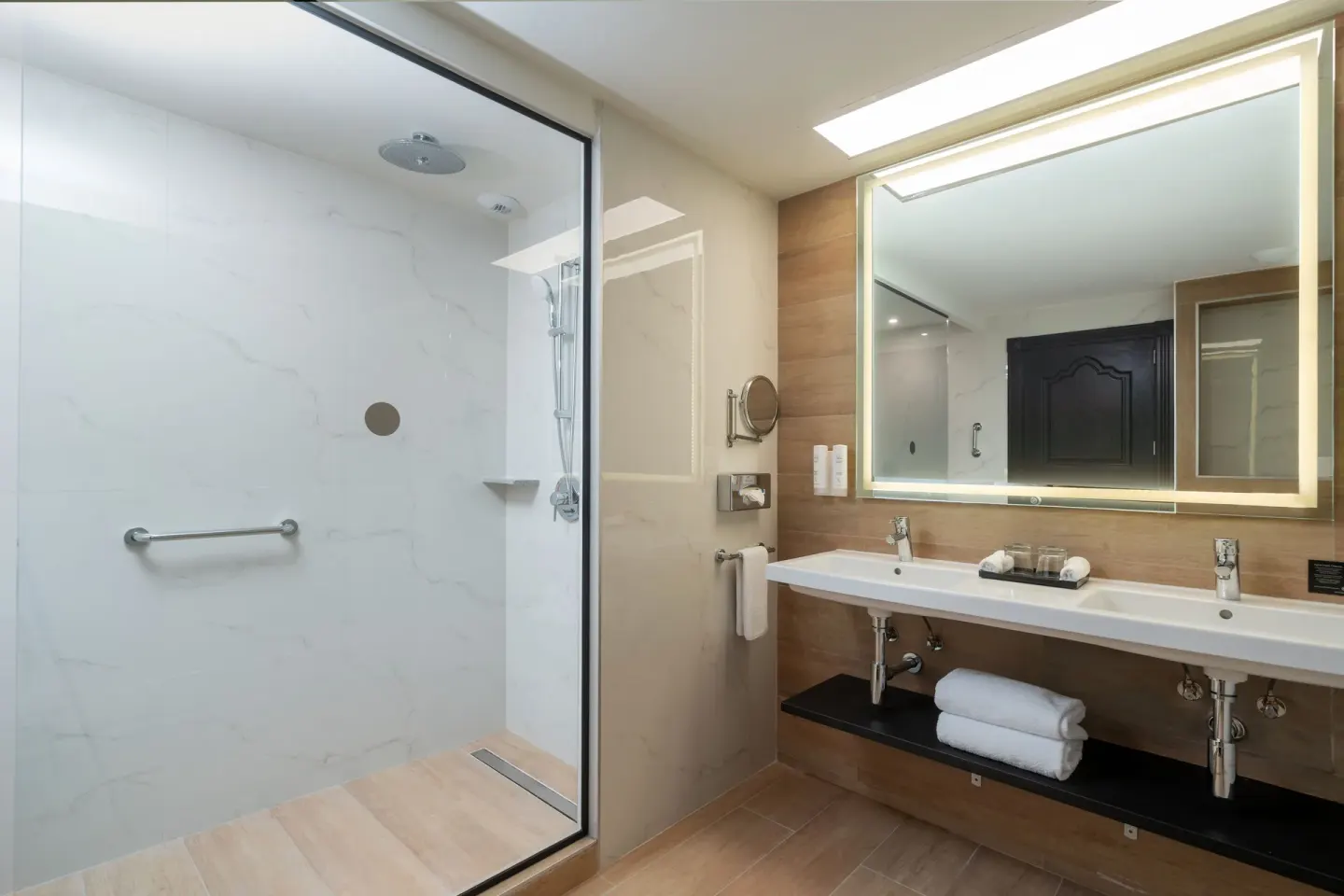 Junior Suite bathroom with double sink and walk-in shower at Hotel Riu Palace Pacifico.