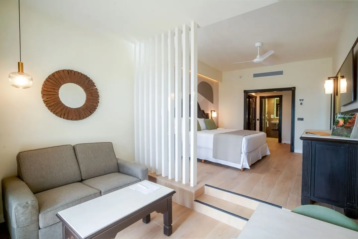 Junior Suite lounge area and raised bedroom at Hotel Riu Palace Pacifico.