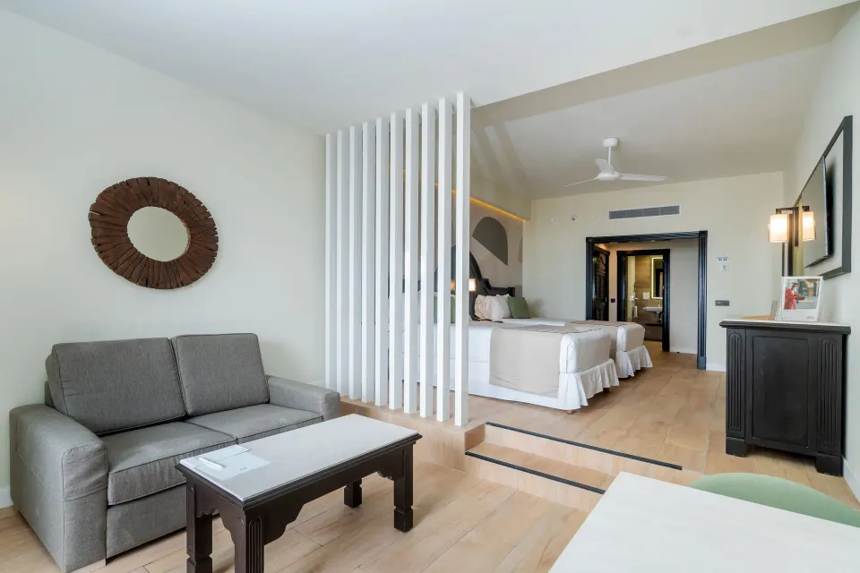 Junior Suite sitting area and bedroom partition at Hotel Riu Palace Pacifico.