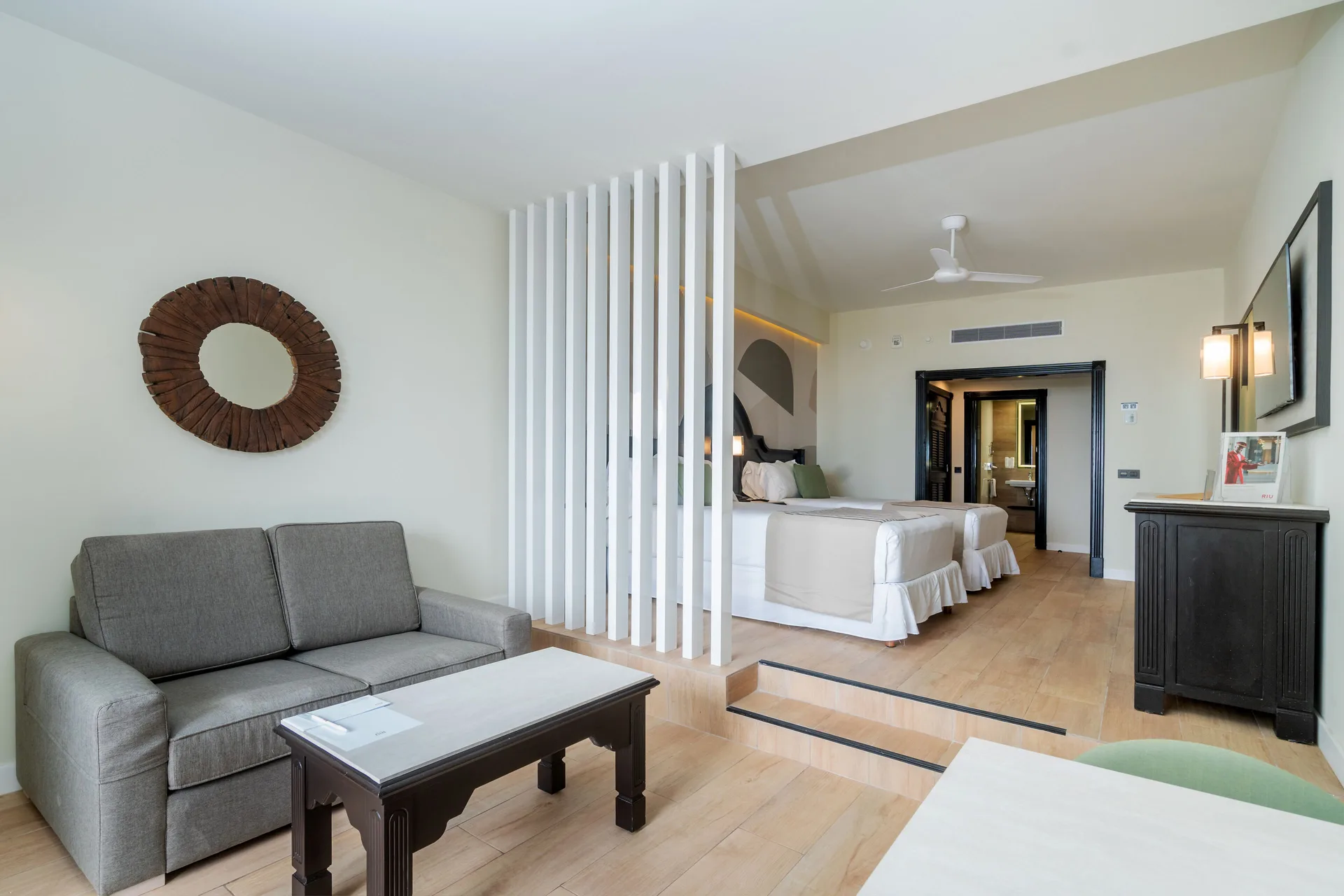 Junior Suite sitting area and bedroom partition at Hotel Riu Palace Pacifico.