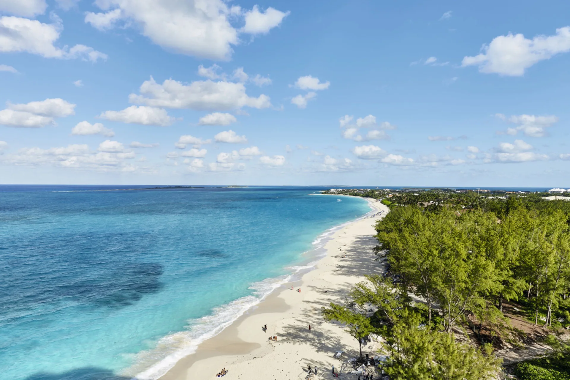 Aerial view of beach and turquoise water by Hotel Riu Palace Paradise Island.