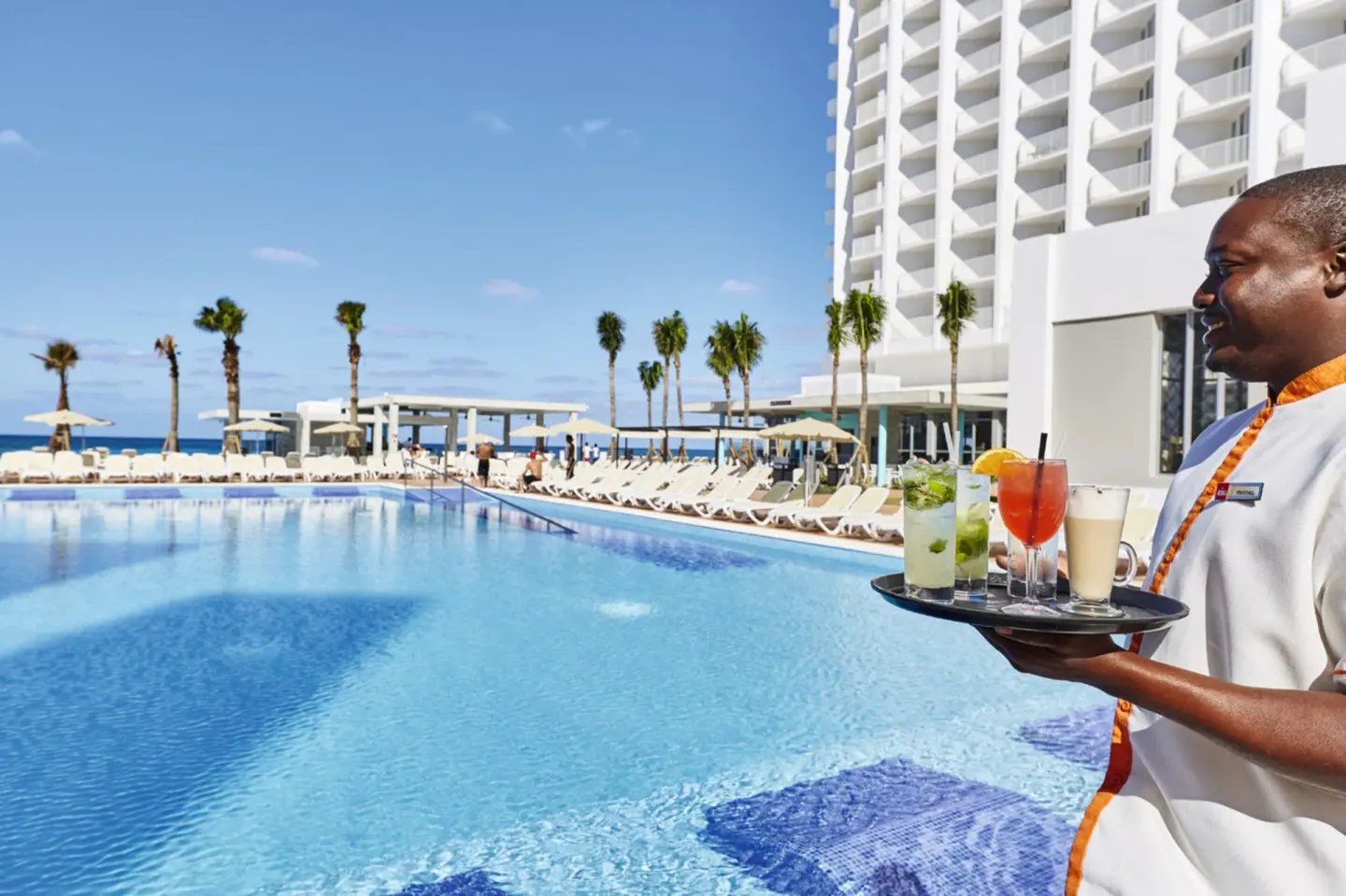 Poolside drinks served beside the pool at Hotel Riu Palace Paradise Island.