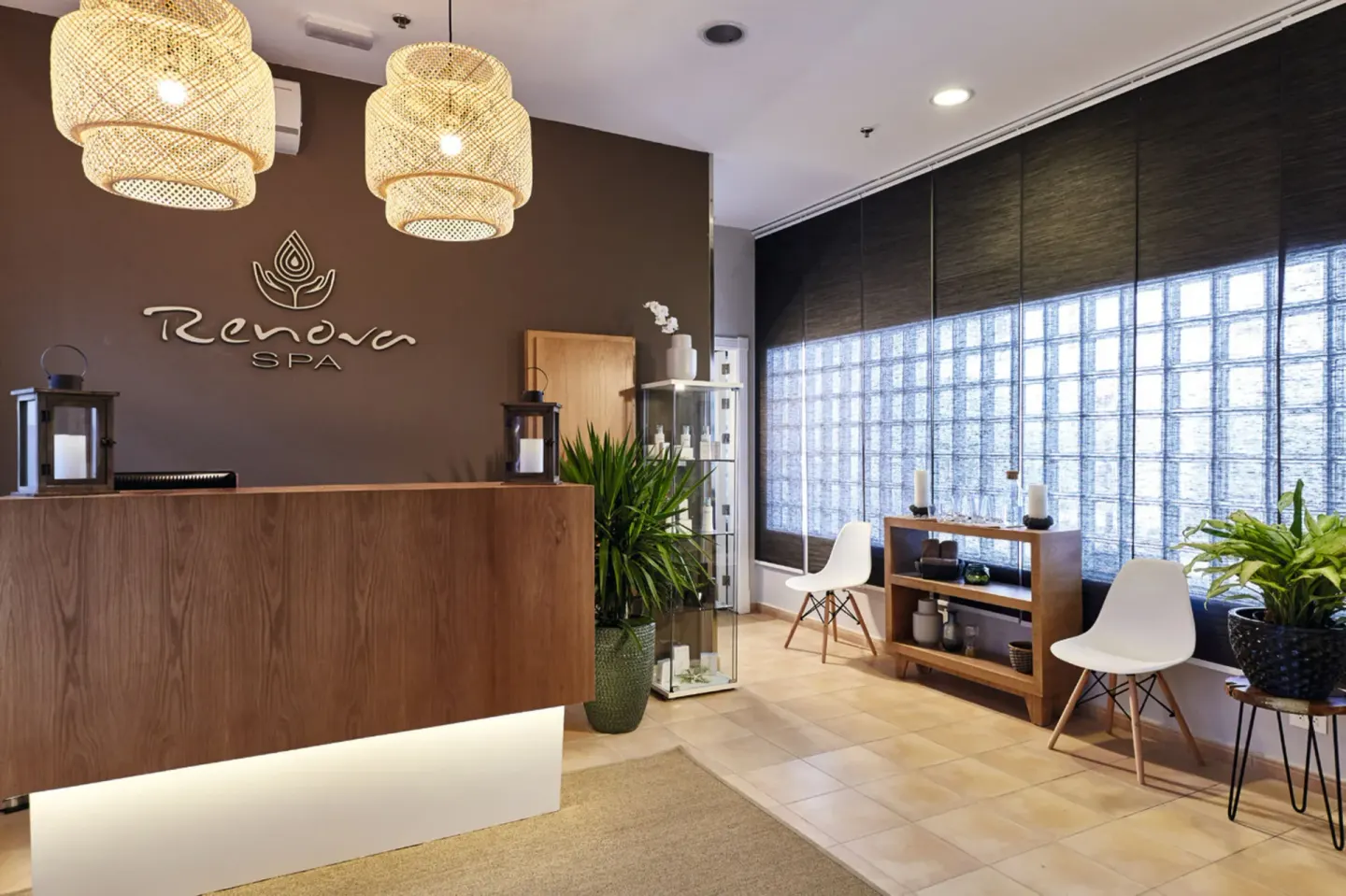 Spa reception with wood desk and seating at Hotel Riu Palace Paradise Island.