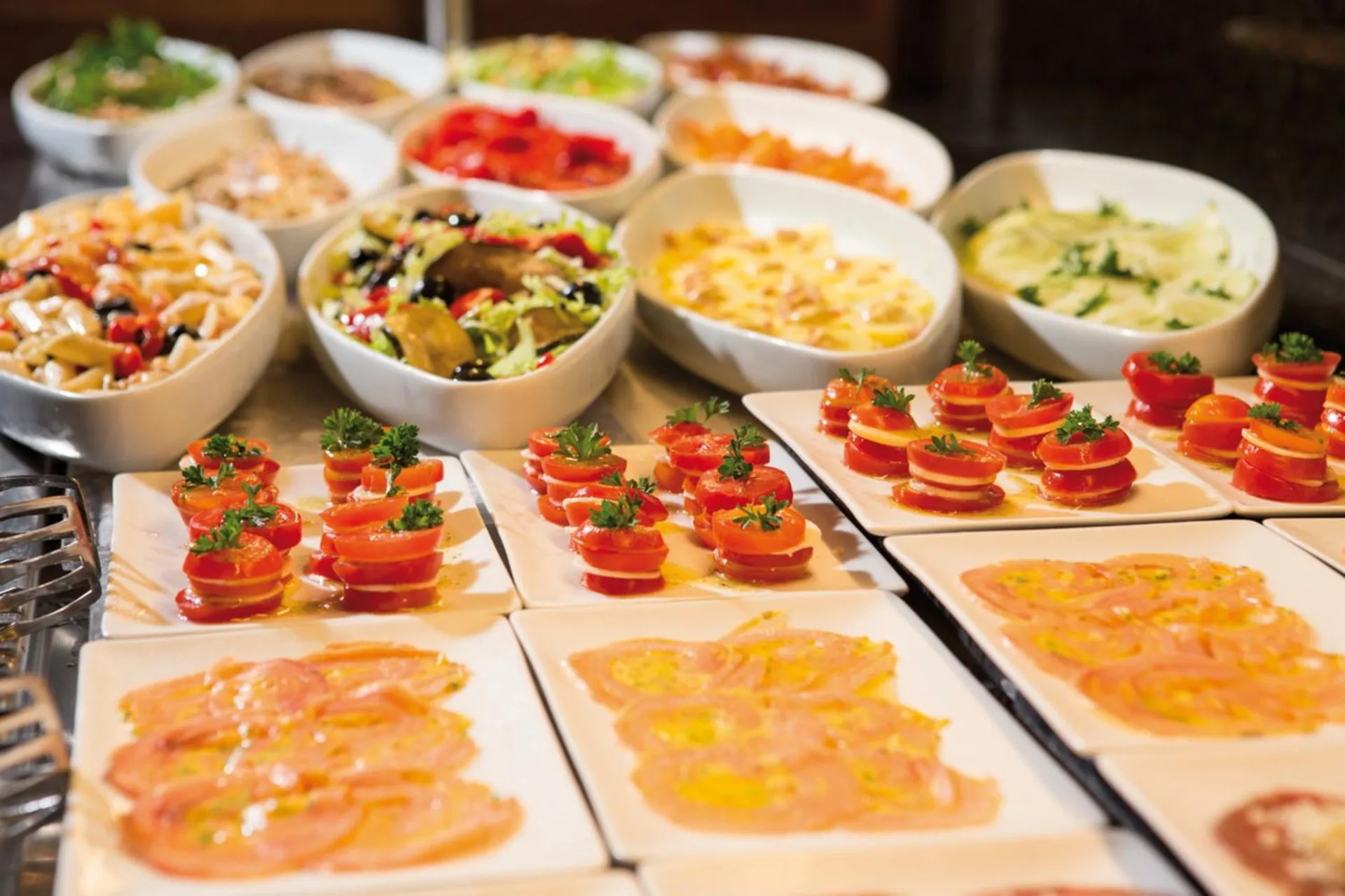 Buffet salads, pasta, and tomato plates at Hotel Riu Palace Peninsula.