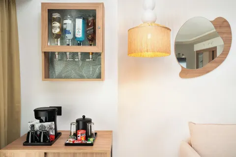 Wall-mounted drink dispenser above the coffee station in an Elite Club Suite Ocean View at Hotel Riu Palace Peninsula.
