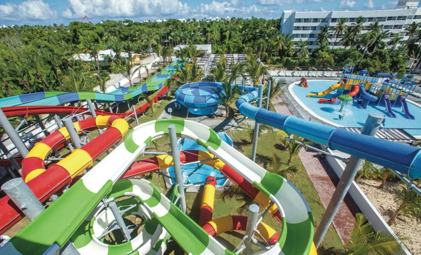Overhead view of twisting water slides and splash areas at Hotel Riu Palace Punta Cana.