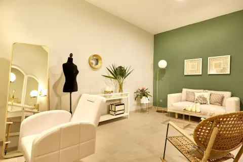 Spa treatment lounge with salon chair and sofa at Hotel Riu Palace Punta Cana.