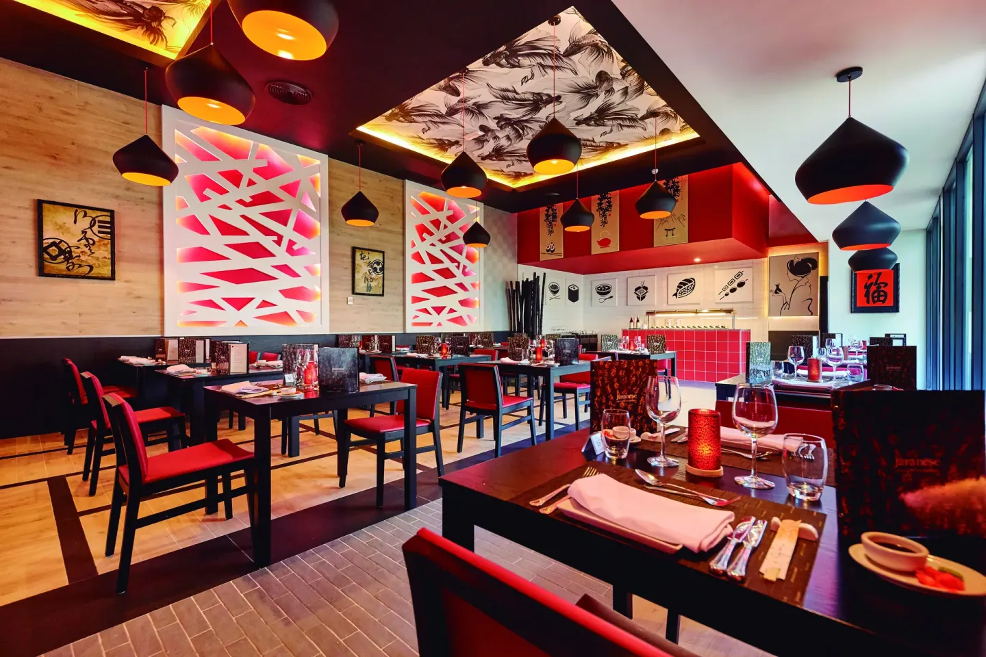 Japanese restaurant dining room with red accents at Hotel Riu Palace Punta Cana.