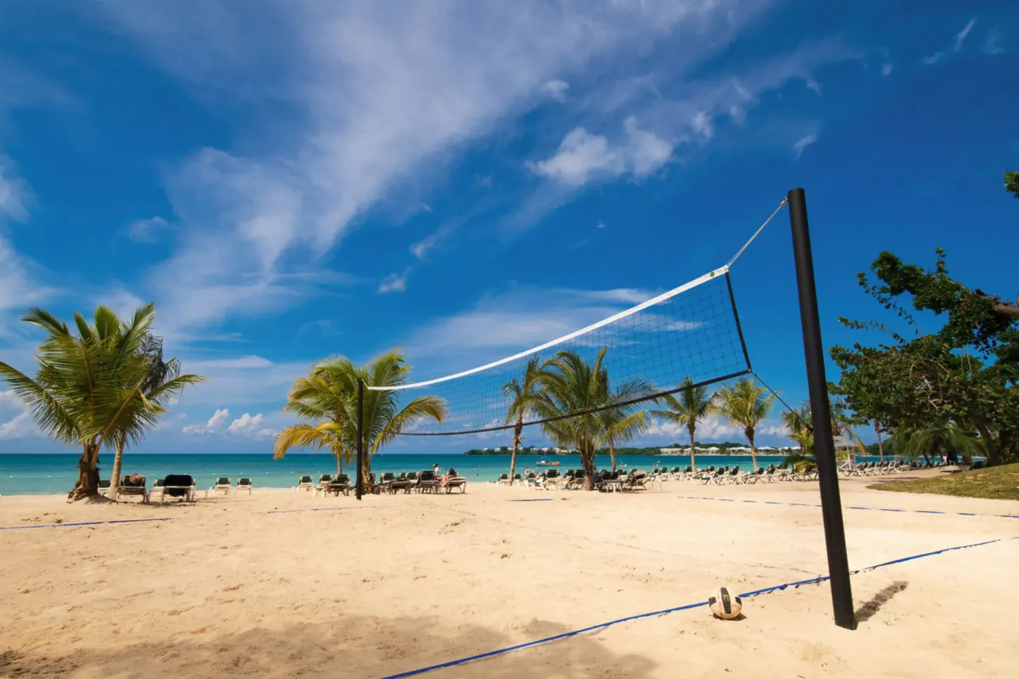 Beach volleyball net on the sand at Hotel Riu Palace Tropical Bay.
