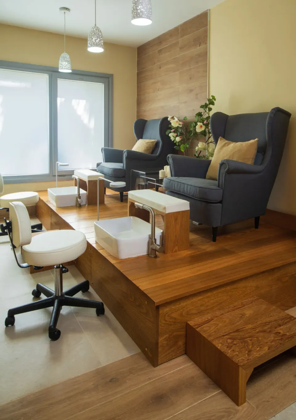 Nail salon pedicure chairs and foot basins at Hotel Riu Palace Tropical Bay.