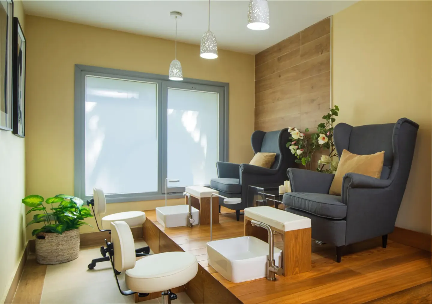 Pedicure room with high-back chairs and foot basins at Hotel Riu Palace Tropical Bay.