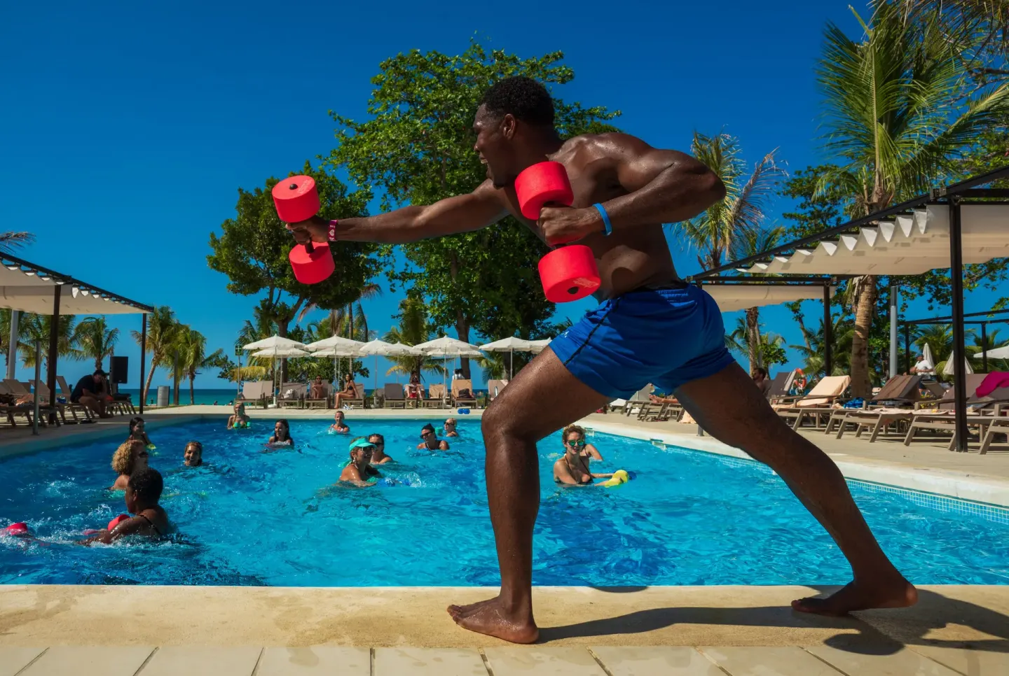 Pool fitness instructor leads an aqua workout at Hotel Riu Palace Tropical Bay.
