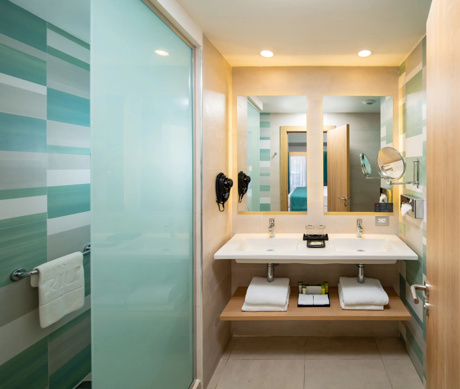 Lateral Sea View Junior Suite bathroom vanity at Hotel Riu Palace Tropical Bay.