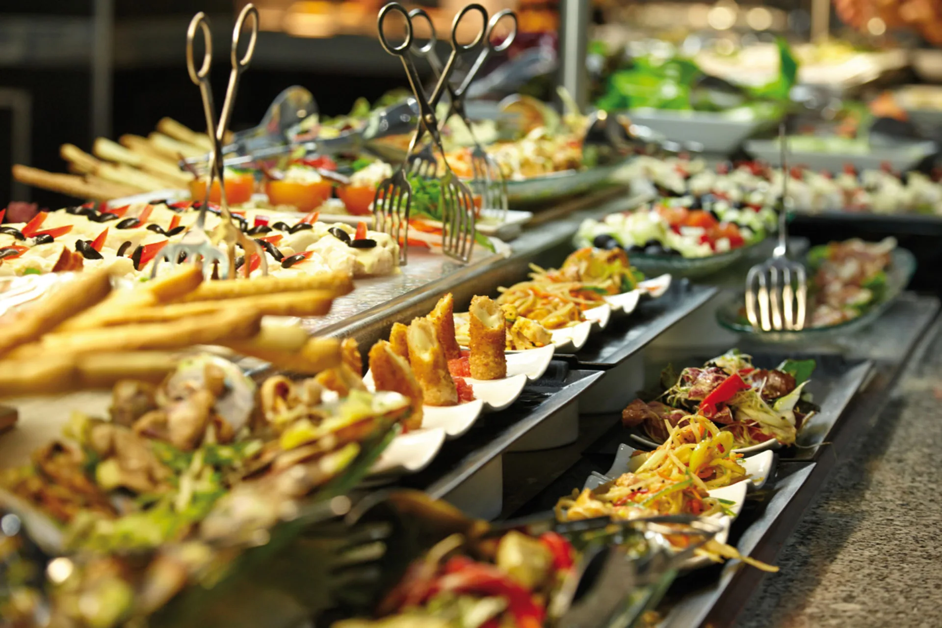 A buffet counter displays salads and appetizers at Hotel Riu Reggae.