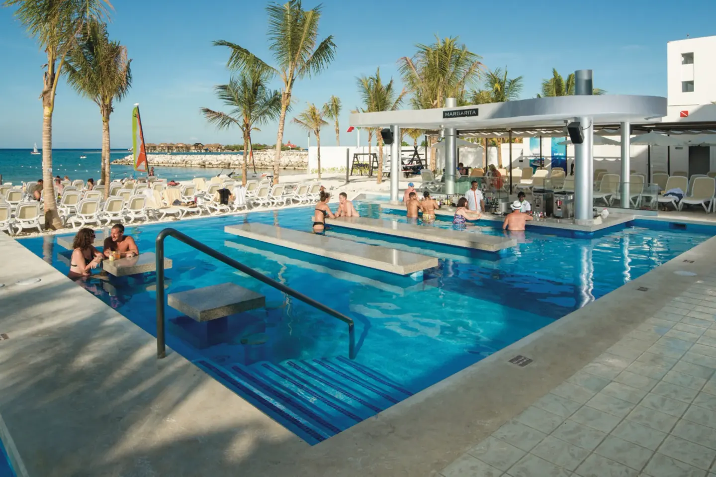 Margarita swim-up bar and pool beside the beach at Hotel Riu Reggae.