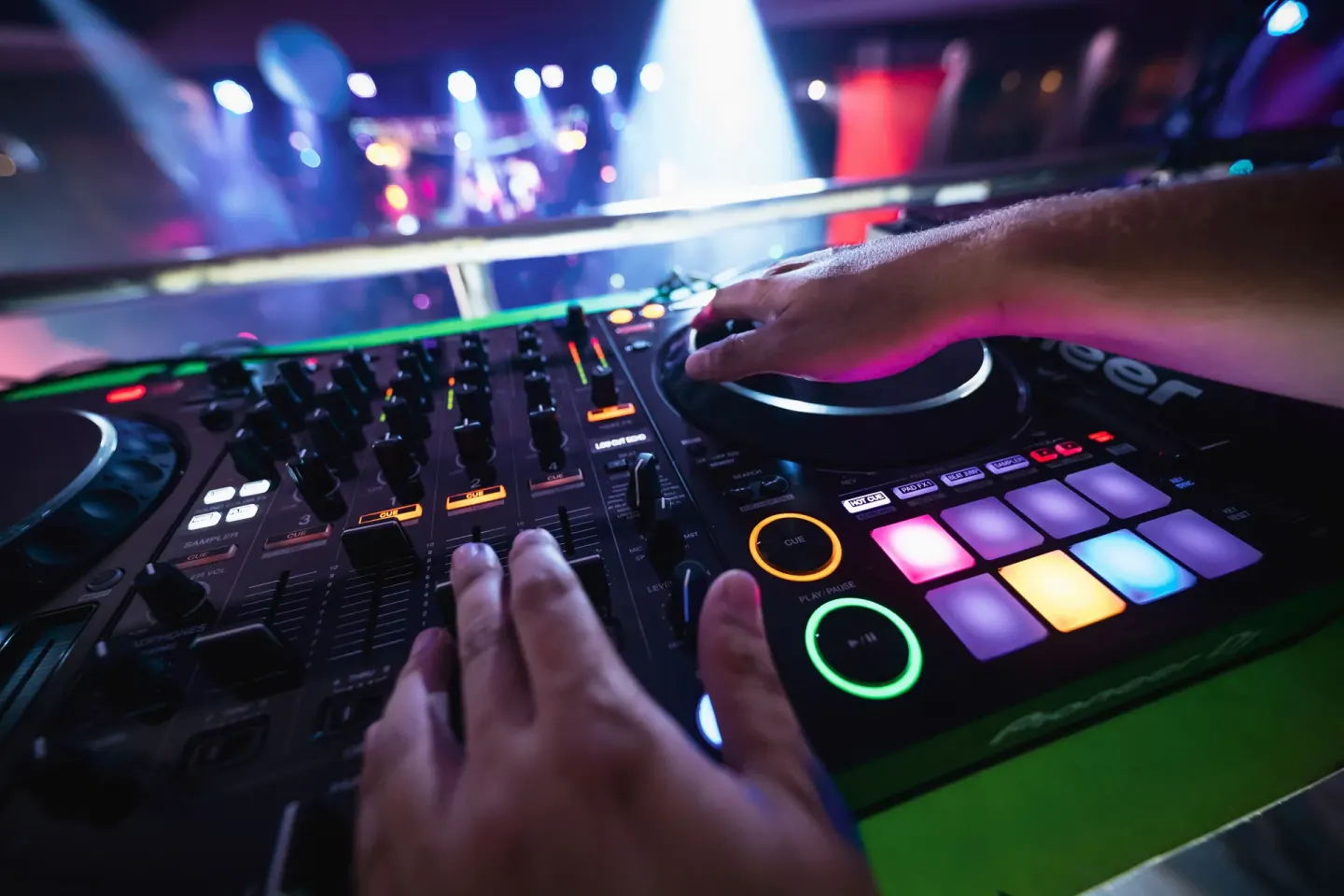 A DJ operates a mixing console during a nightclub event at Hotel Riu Republica.