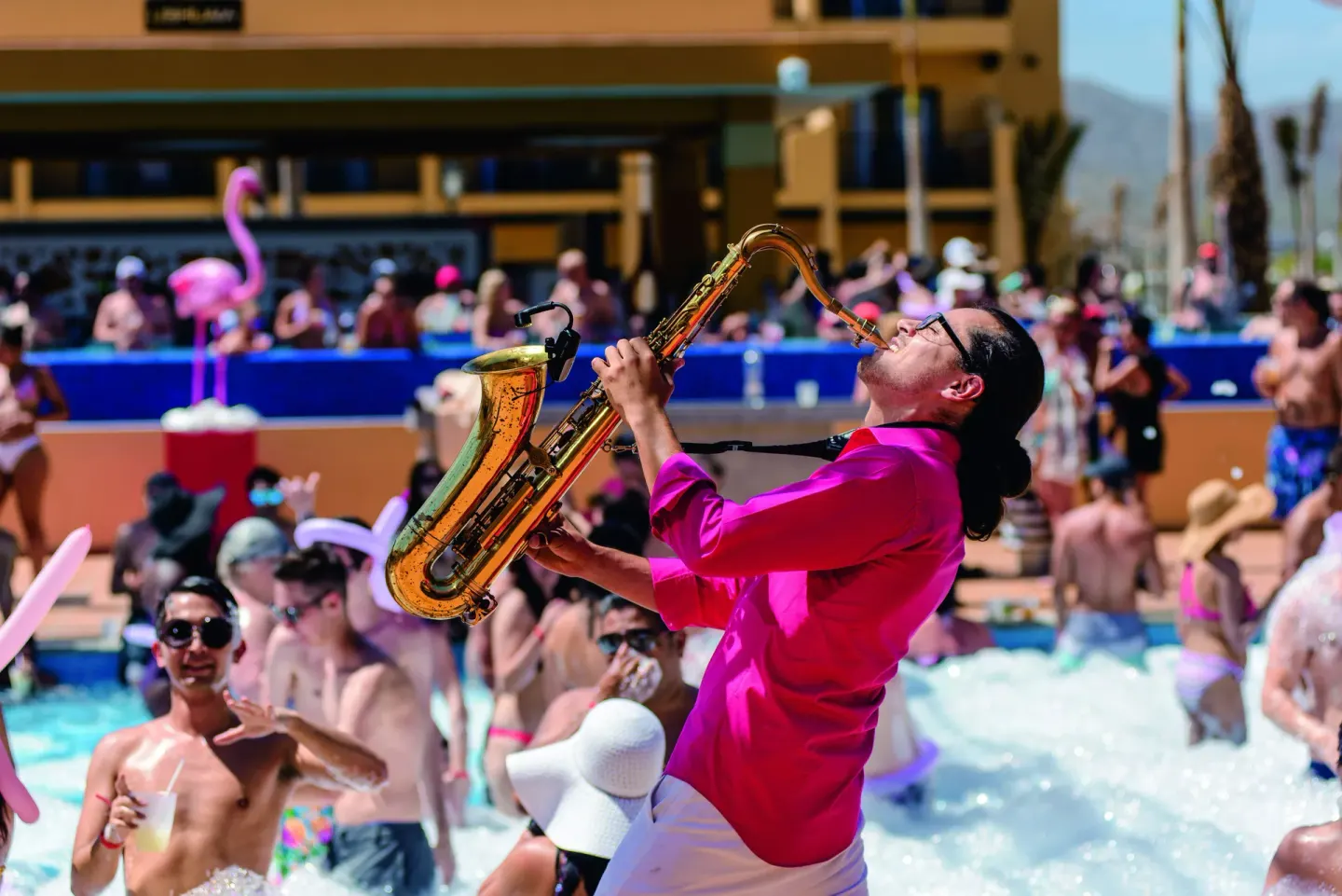 Saxophonist performs during a foam pool party at Hotel Riu Santa Fe.