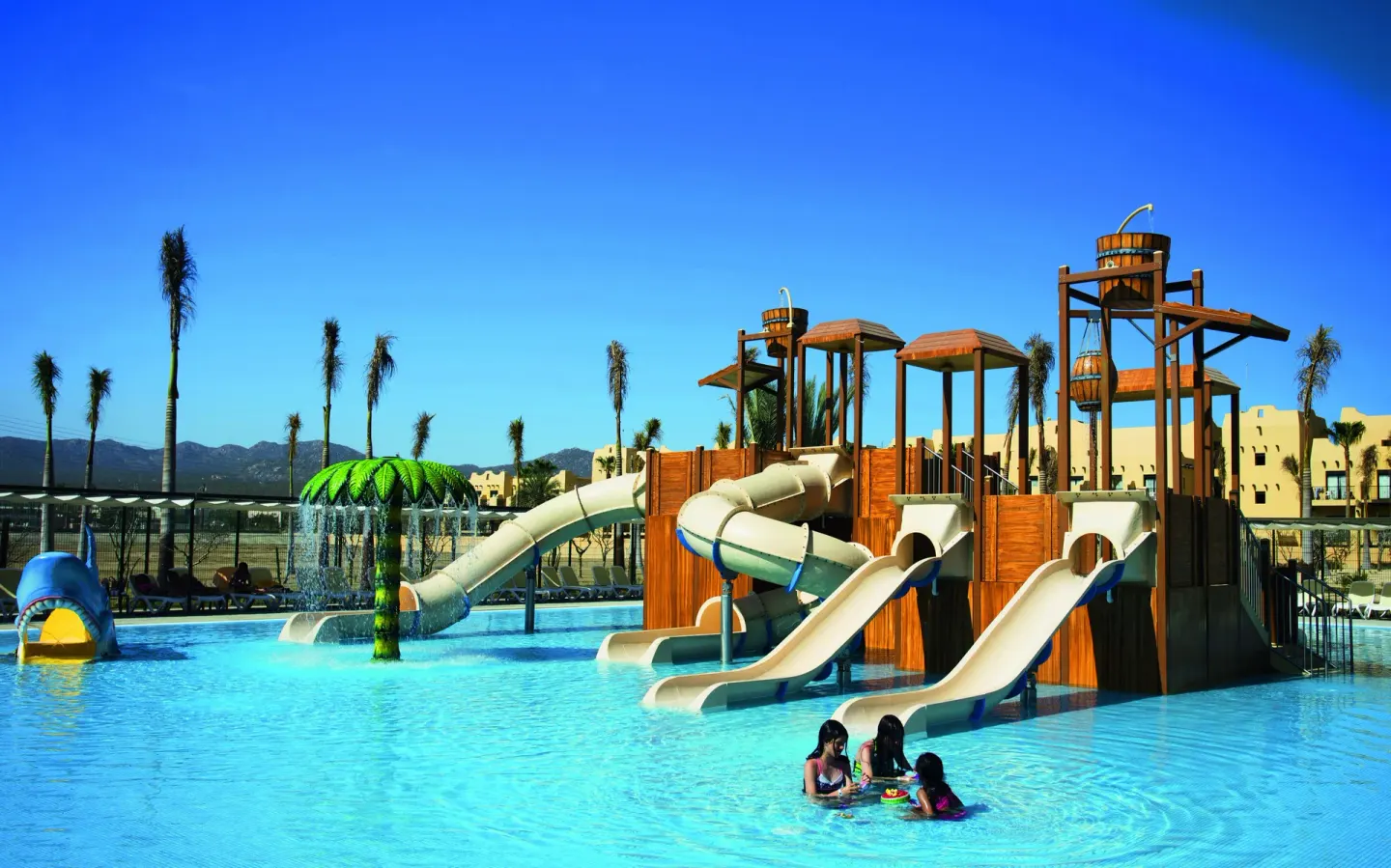 Kids' water park with slides and splash features at Hotel Riu Santa Fe.