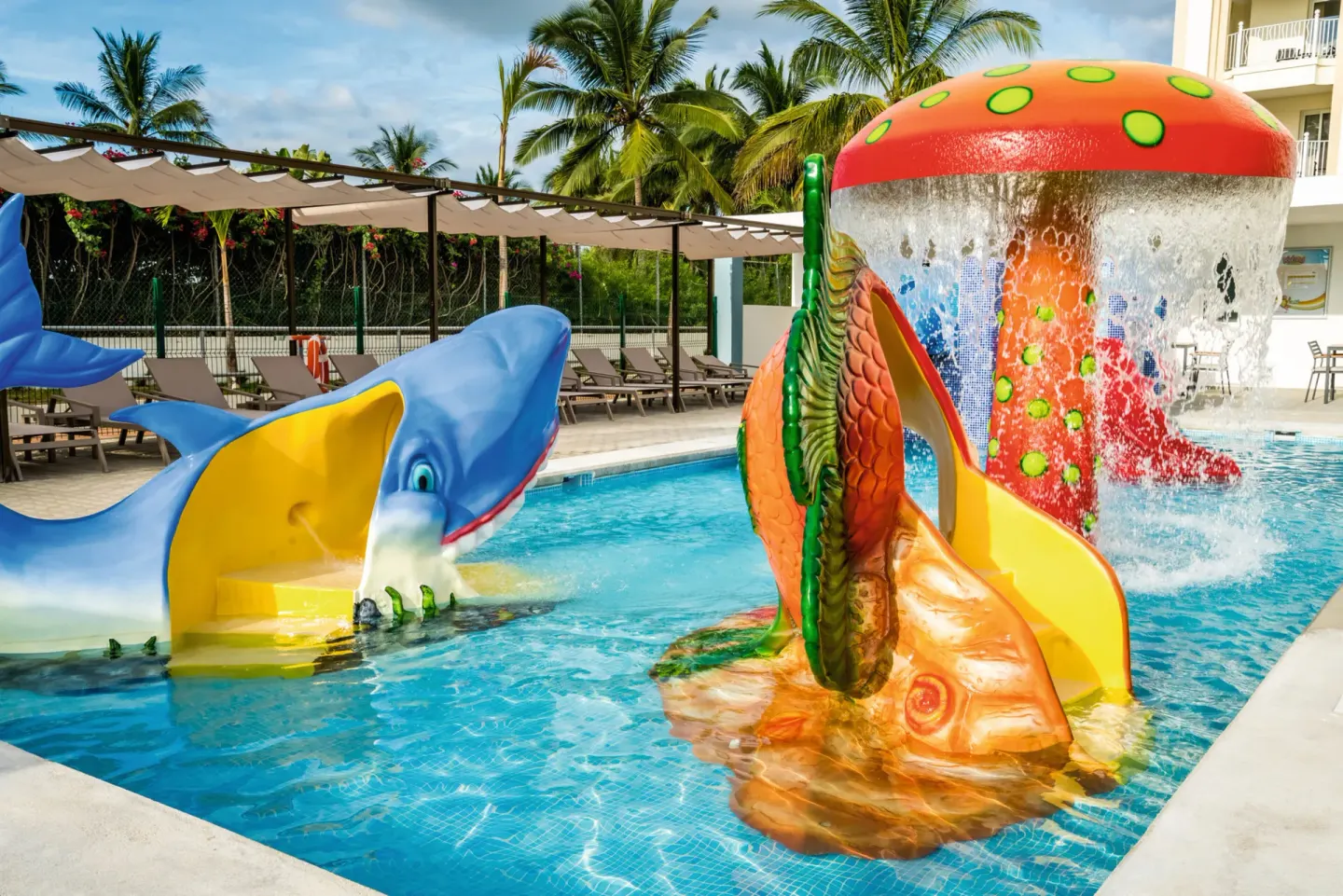 Children's splash pool with animal slides and water feature at Hotel Riu Vallarta.
