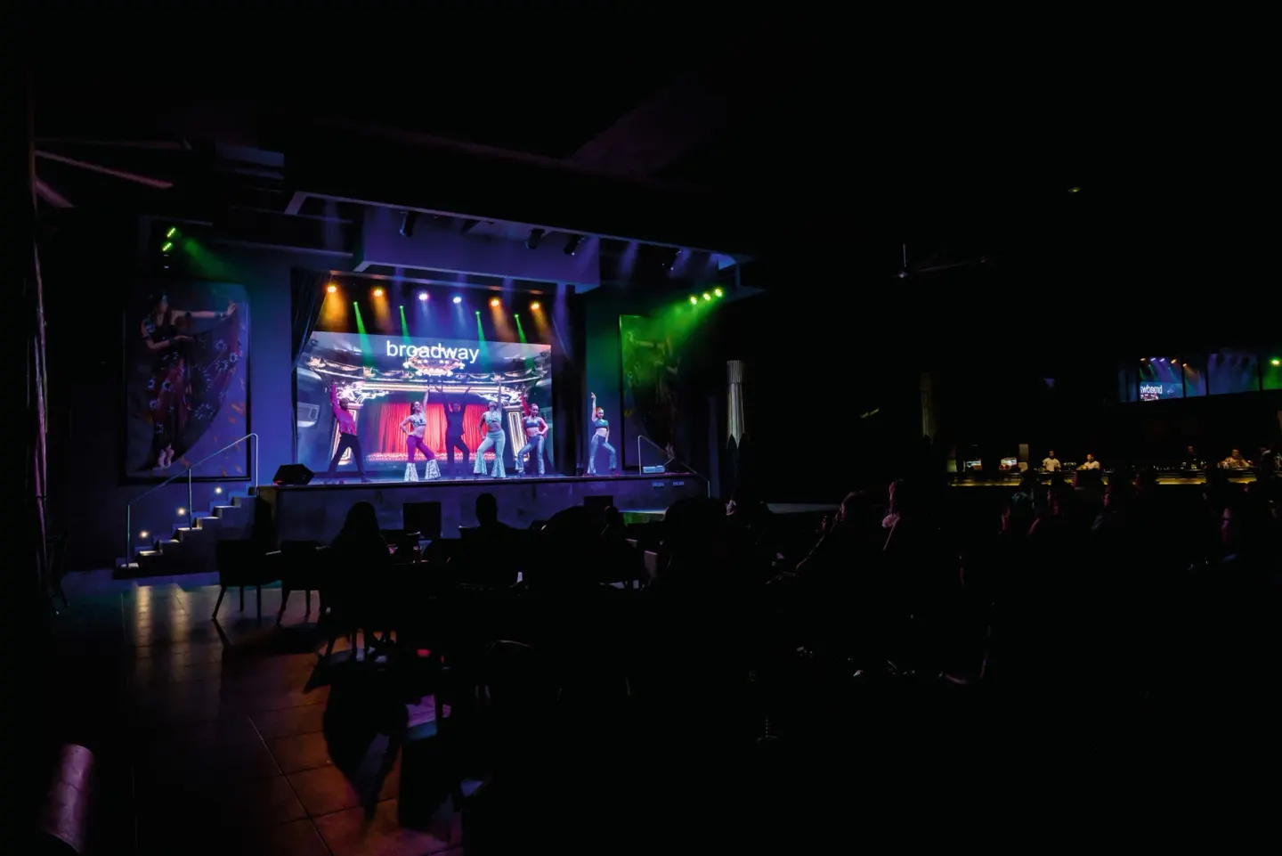 Audience watches a Broadway-style stage show at Hotel Riu Vallarta.