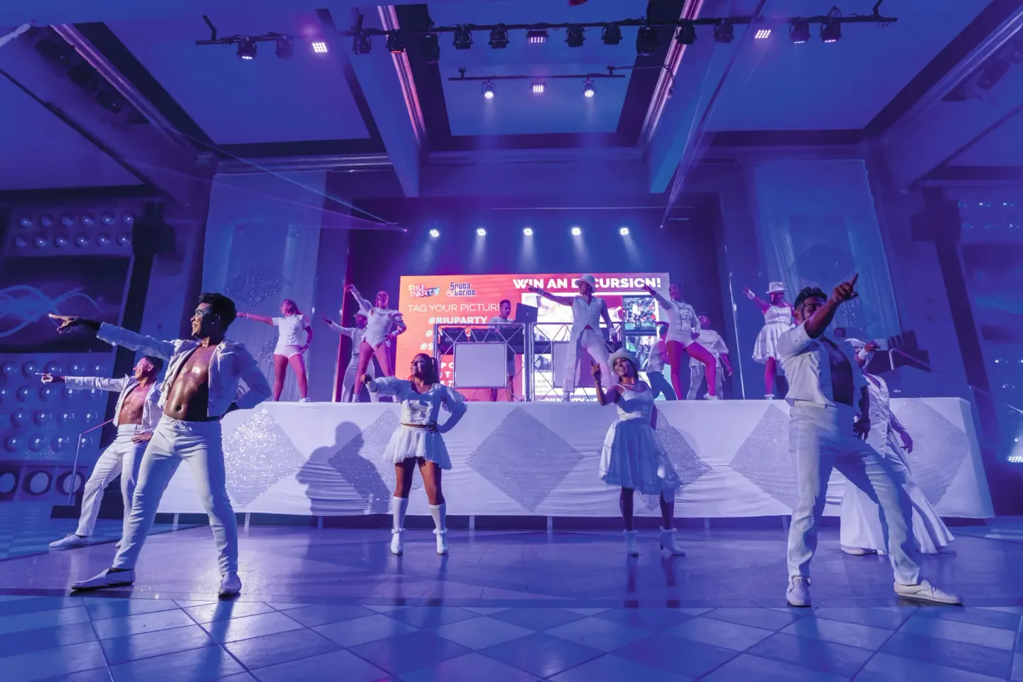 Costumed dancers perform on an indoor stage at Hotel Riu Vallarta.