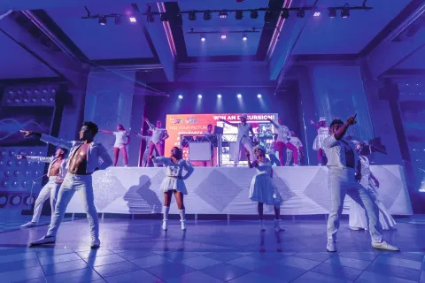 Costumed dancers perform on an indoor stage at Hotel Riu Vallarta.