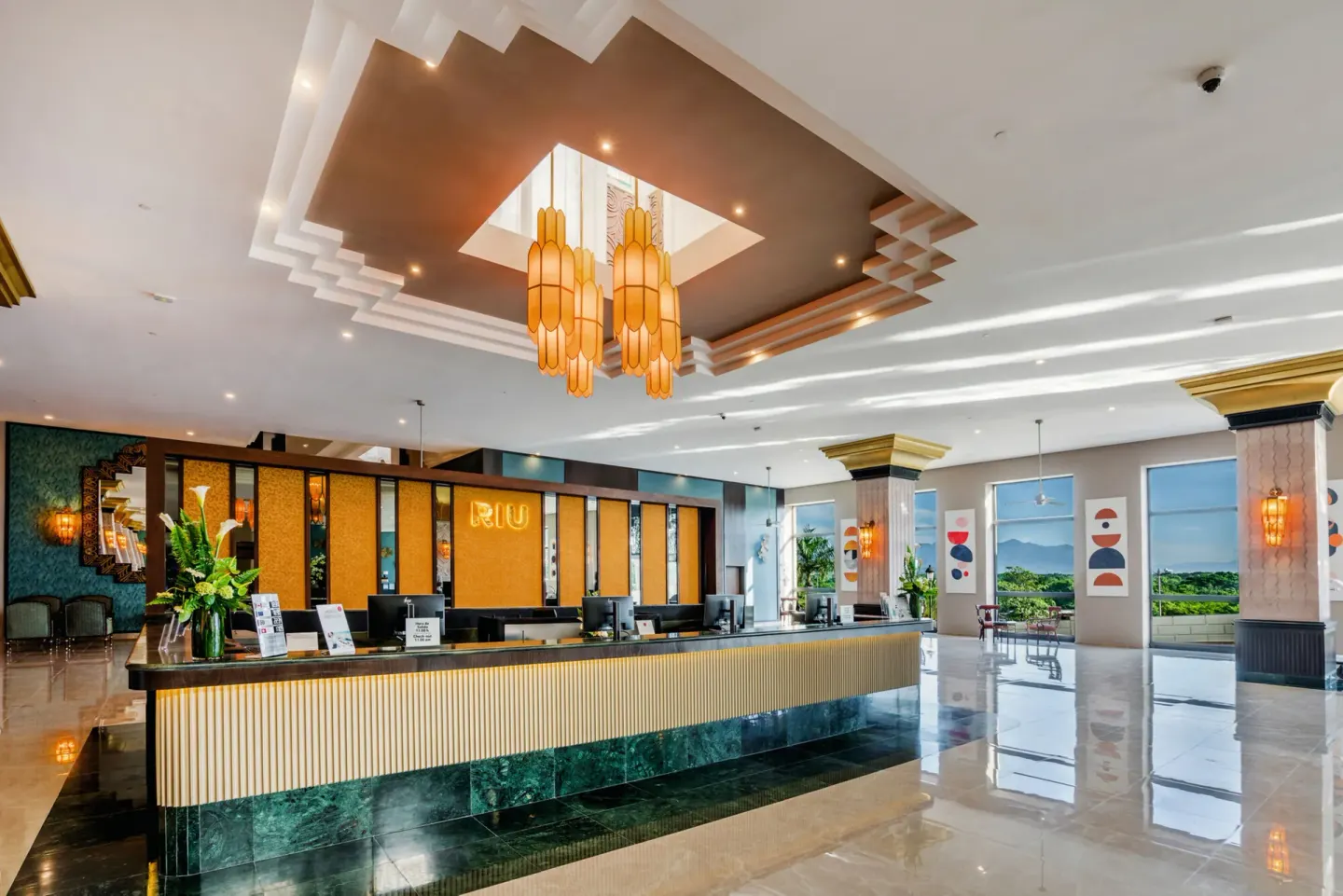 Reception desk and polished lobby interior at Hotel Riu Vallarta.