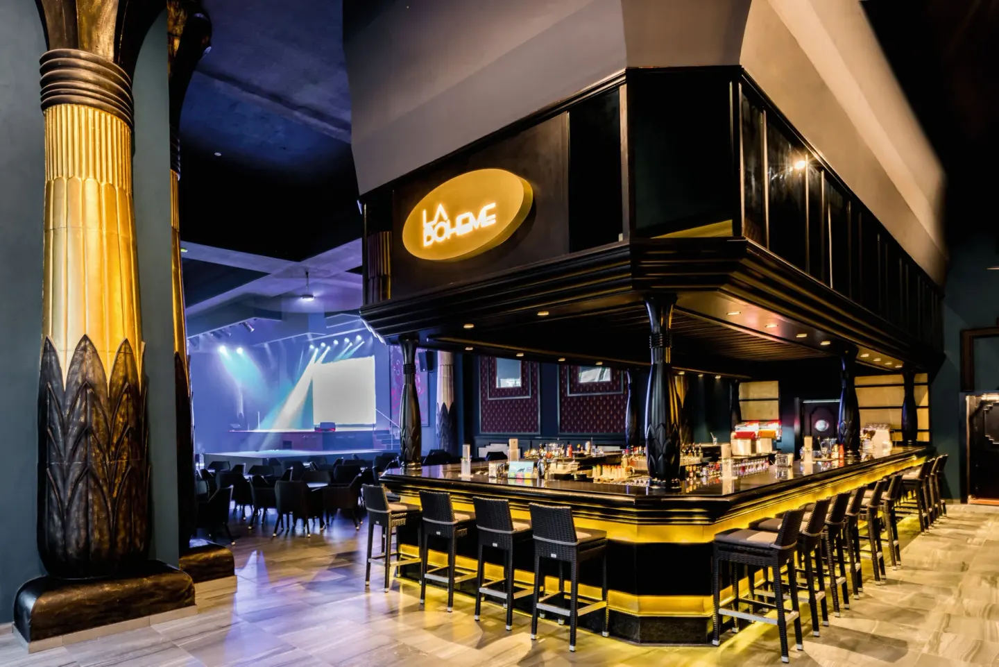 La Boheme lounge bar with black-and-gold counter at Hotel Riu Vallarta.
