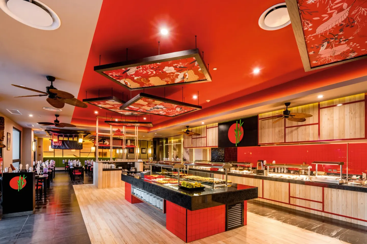 Asian buffet counter with red ceiling panels at Hotel Riu Vallarta.