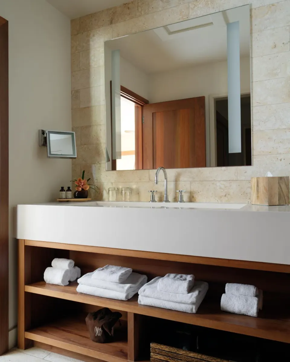Garden View One Bedroom Suite bathroom vanity with towels and mirror at Hotel Wailea.