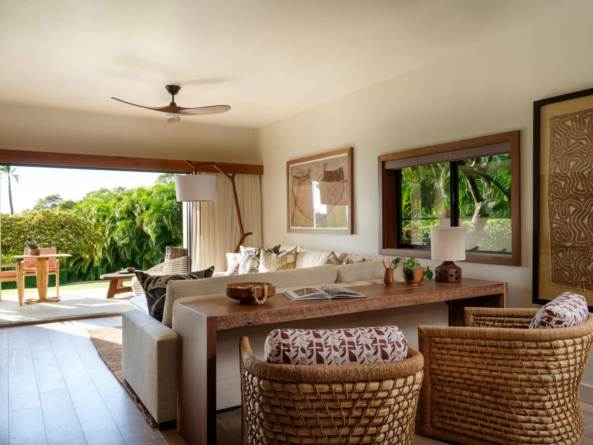 Garden View One Bedroom Suite living room opens to a furnished lanai at Hotel Wailea.