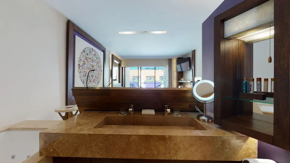 Suite Garden Spa bathroom vanity facing the guest room at Hotel Xcaret Arte.