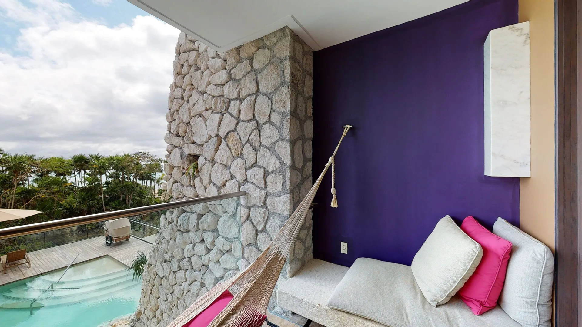 Suite Oceanfront King balcony daybed and hammock at Hotel Xcaret Arte.