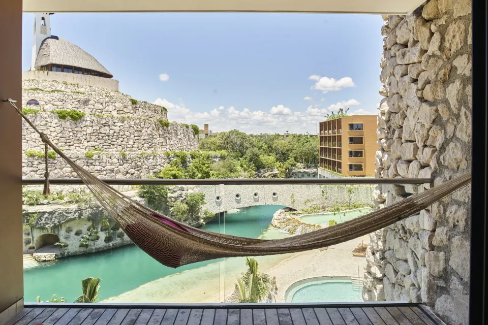 Suite River King balcony hammock overlooking the river at Hotel Xcaret Arte.