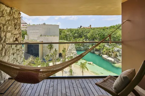 Suite River King terrace hammock with river and garden views at Hotel Xcaret Arte.