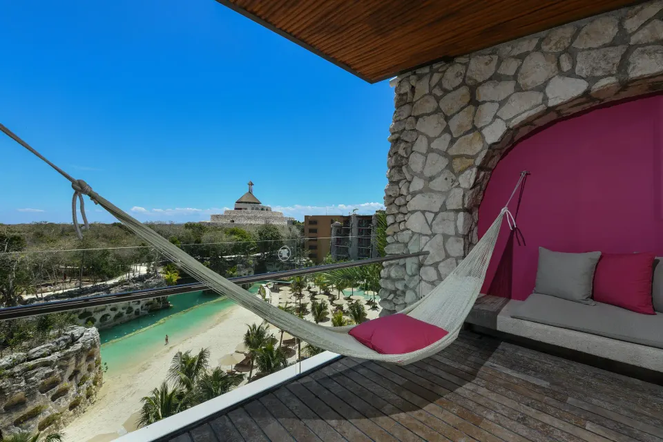 Suite River King terrace with hammock and river view at Hotel Xcaret Arte.