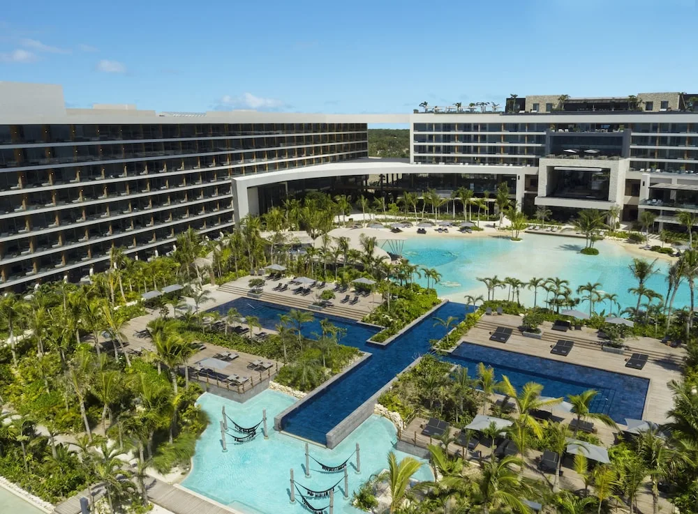 Secrets Moxché Playa del Carmen adults-only all-inclusive resort with beachfront pools and modern luxury design.