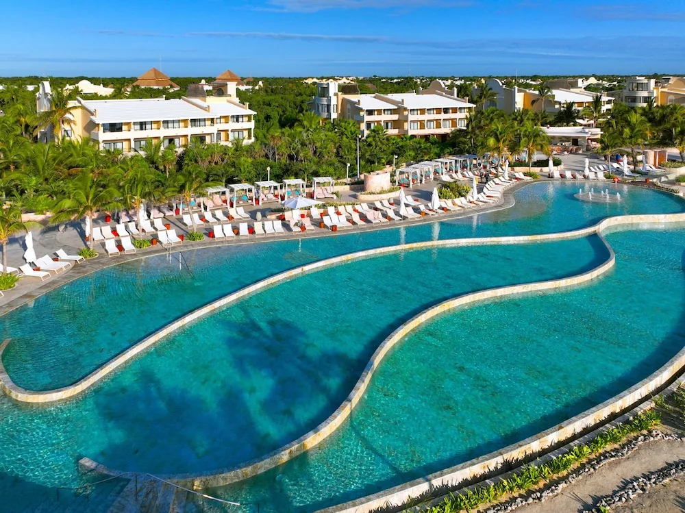 TRS Yucatan Hotel adults-only luxury all-inclusive resort with beachfront pools and modern architecture on the Playa del Carmen.