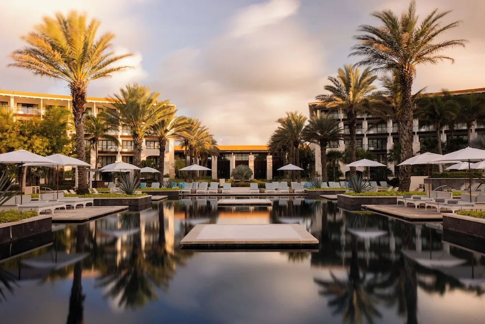 Unico Hotel Playa del Carmen adults-only all-inclusive resort with modern design, beachfront pools, and luxury accommodations.