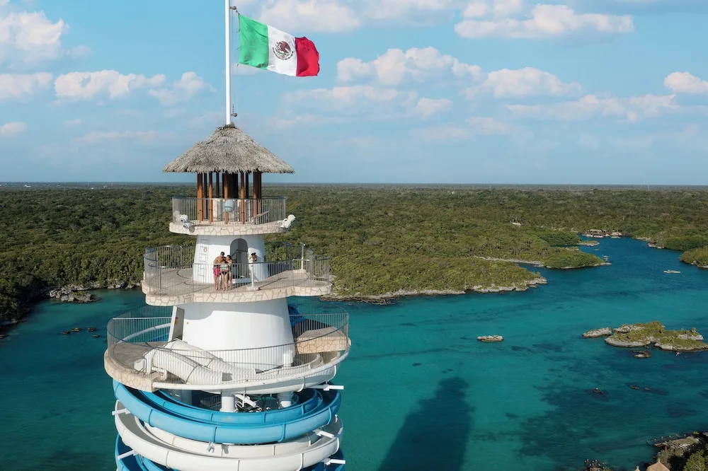 Close view of the scenic tower over turquoise lagoon at Hotel Xcaret Mexico.