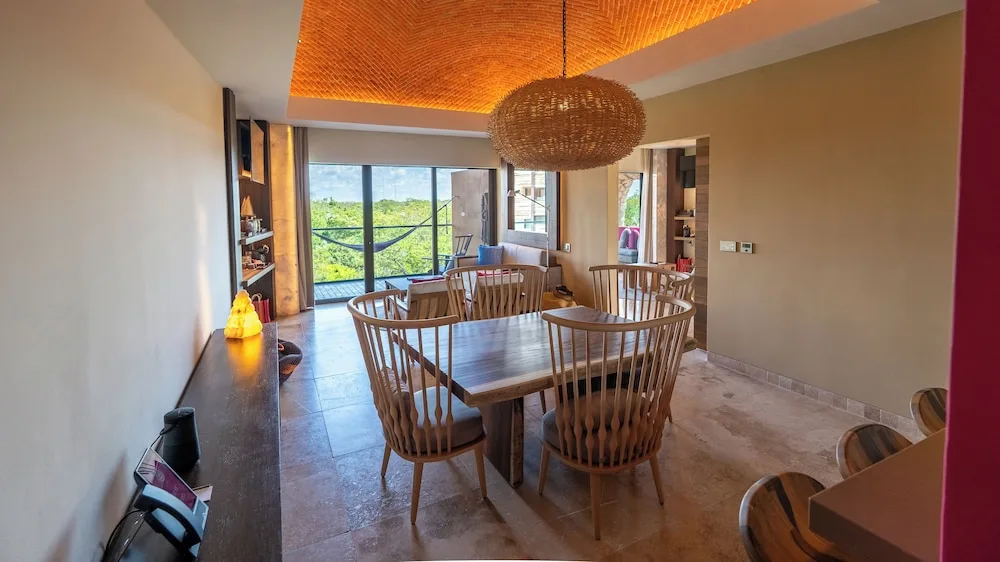 Master Suite dining area with balcony view at Hotel Xcaret Mexico.
